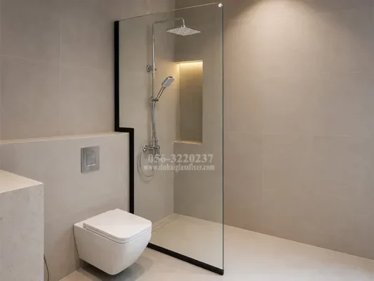 Black-framed tempered glass shower screen with a custom cutout for contemporary bathrooms.
