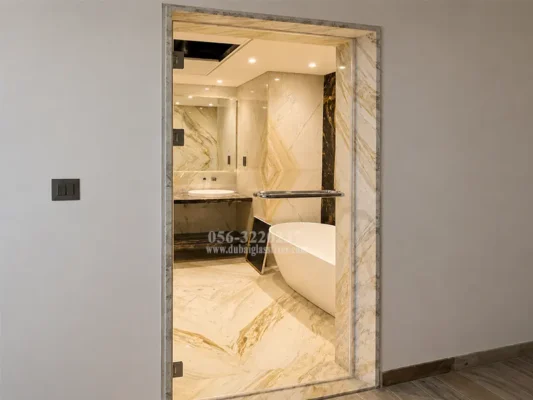 Frameless tempered glass swing shower door installed in a modern bathroom.