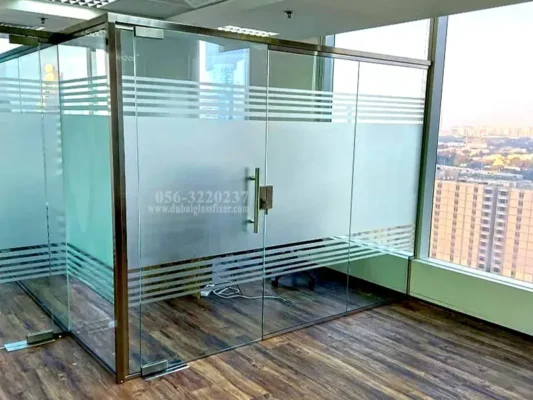 Frameless frosted glass partition installed in a modern office with tempered safety glass.