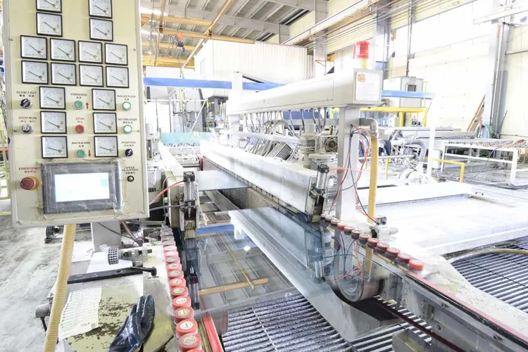 Tempered glass processing machine in operation